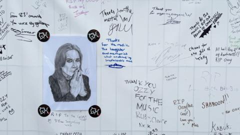 Ozzy tributes written on a banner on display at Bloodstock Festival, with a hand sketched portrait of Ozzy in the center.