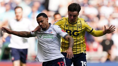 Bolton Wanderers' Josh Dacres-Cogley in action against Oxford United's Tyler Goodrham