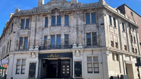 A grand old white stone building