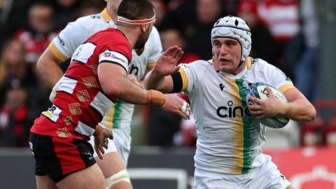 Saints hooker Curtis Langdon is tackled by Gloucester flanker Lewis Ludlow