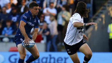 Sale Sharks fly-half George Ford offloading the ball while playing against Bristol Bears