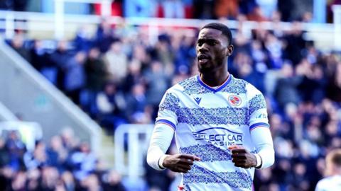 eading's Kelvin Ehibhatiomhan celebrates after Wigan Athletic's Will Aimson scores an own goal