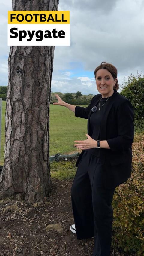 Katie Gornall at Middlesbrough's training ground behind a tree