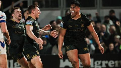 Hull FC's Herman Ese'ese celebrating with his teammates after scoring.