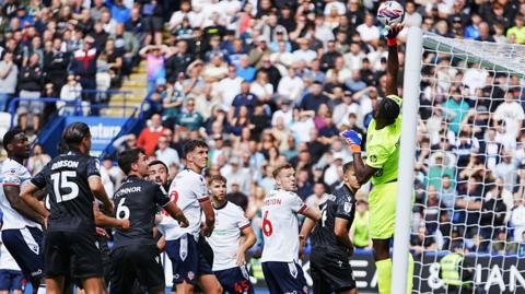 Wrexham goalkeeper Arthur Okonkwo made a string of good saves against Bolton