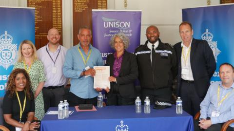 Union and police representatives at the signing ceremony of the anti-racism charter.