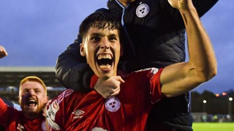 Oxford United have signed Shelbourne FC defender Stephan Negru from Ireland's top flight.