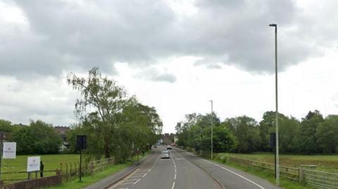 The B4361 a single lane carriageway with green land either side 