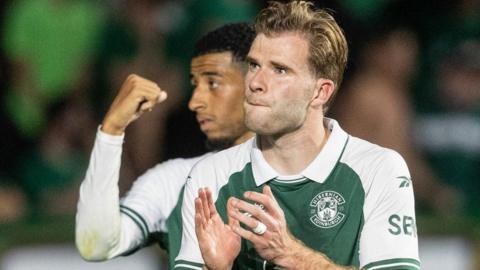 Chris Cadden applauds the Hibs crowd after Thursday's win over Malisheva