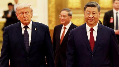 Trump and Xi walk side by side as they enter the state banquet