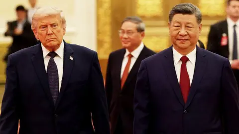 Trump and Xi walk side by side as they enter the state banquet