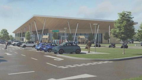 Artist impression of the proposed service station - showing a single storey glass fronted building with an overhanging roof with steel supports. There are cars parked in front and a green grassed area to the right hand side with a children's play area