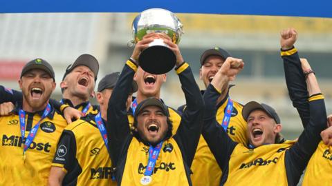Kiran Carlson of Glamorgan lifts the Metro Bank One Day Cup following the victory over Somerset at Trent Bridge