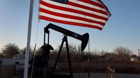 An oil pumpjack setup in a residential neighborhood pulls oil from the Permian Basin oil field on March 13, 2022 in Odessa, Texas.