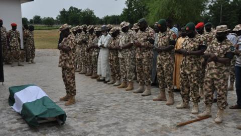 Nigerian soldiers are seen during the funeral on September 26, 2020 of their fellow servicemen killed in the attack on vehicles carrying Borno governor Babagana Umara Zulum near the town of Baga on the shores of Lake Chad.