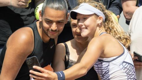 Mirra Andreeva poses with fans after winning at the French Open