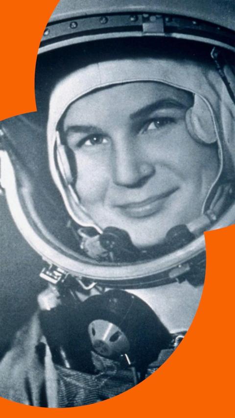 Valentina Tereshkova, the first woman in space, wearing a cosmonaut suit, smiling to camera