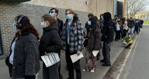 A queue of people line up to be vaccinated at the University of Kent