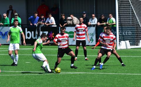 Ross Allen takes a shot for Guernsey FC