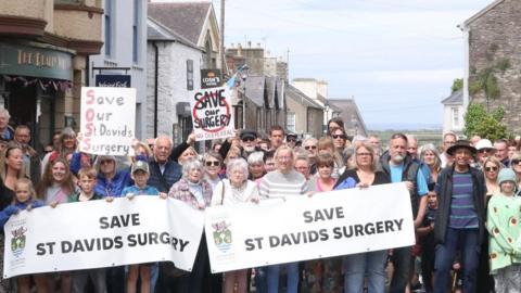 campaigners in the streets with banners