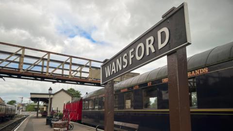 Platform with sign at Nene Valley Railway