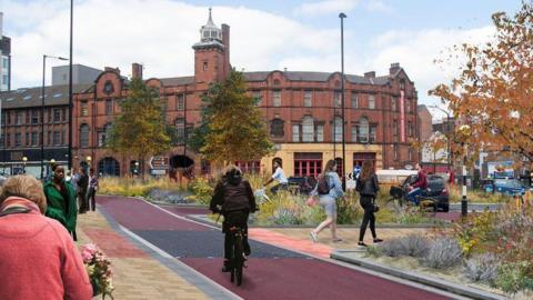 A photograph of West Bar shows a cyclist on the proposed cycle lane, making their way towards the Emergency Service Museum.
Two female pedestrians have just crossed the road. The trees along the cycle track appear to be changing their colour for autumn.