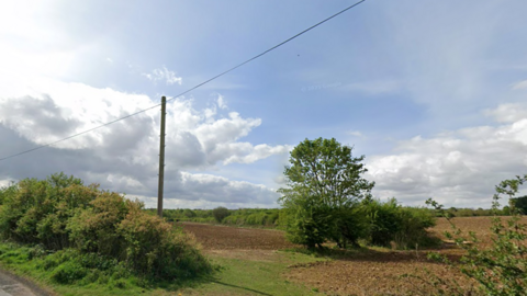 Google Streetview images of ploughed fields and trees next to a country road