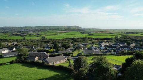 Gwynedd council has turned down a plan for homes in Botwnnog against officials' advice