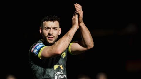 Jake Connor applauds supporters