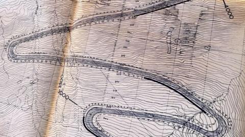 Technical drawing showing hairpin bends on the proposed road