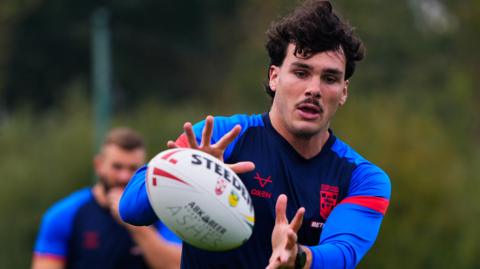 Herbie Farnworth receives the ball during a training session