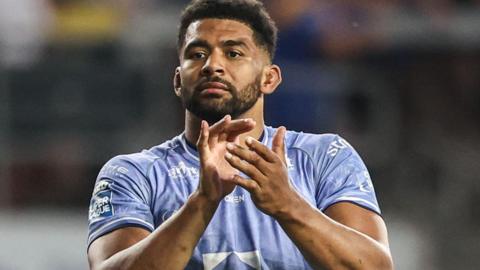 Kallum Watkins applauds the fans after a Leeds Rhinos match