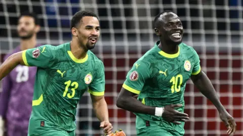 Sadio Mane celebrates a goal for Senegal