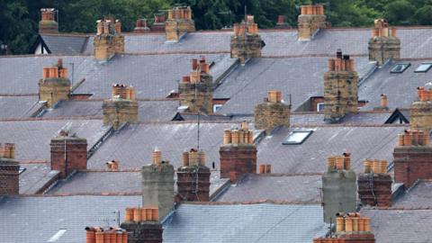 Rows of rooftops and chimneys
