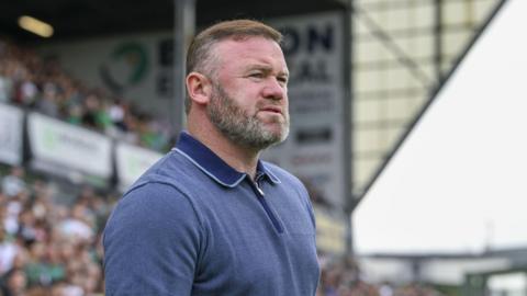 Wayne Rooney, Plymouth Argyle manager, standing on the touchline during the 1-0 defeat against Stoke City