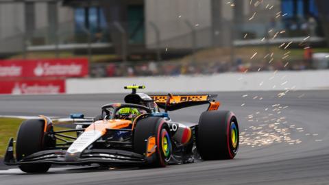 Sparks fly from the back of Lando Norris' McLaren during final practice for the British Grand Prix