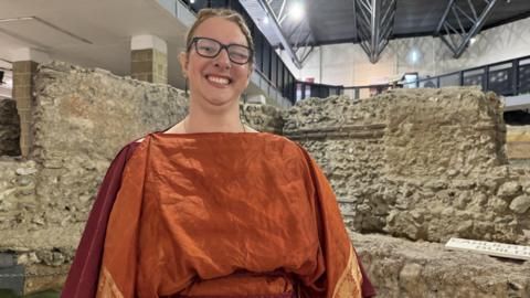 Councillor Charlotte Zosseder dressed in a toga for the relaunch of the Roman Painted House