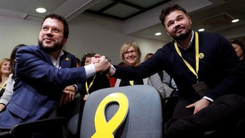 Pere Aragonès, Catalonia's vice president, and MP of Catalan pro-independence party Esquerra Republicana (ERC) Gabriel Rufian shake hands during a meeting held in Barcelona, Catalonia