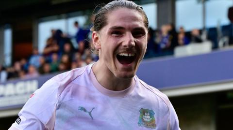 Lorent Tolaj celebrates scoring against AFC Wimbledon
