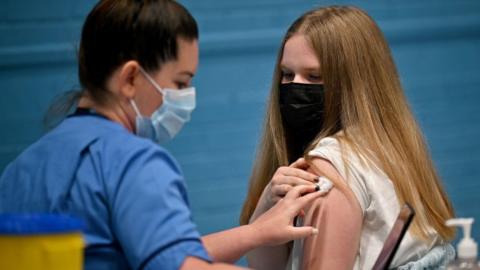 Teenager being vaccinated