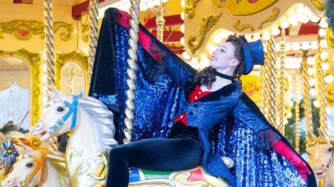 Scottish Ballet dancer Melissa Parsons poses on a carousel 