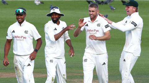 Nottinghamshire players Ben Martindale, Haseeb Hameed, Olly Stone and Freddie McCann celebrate a wicket
