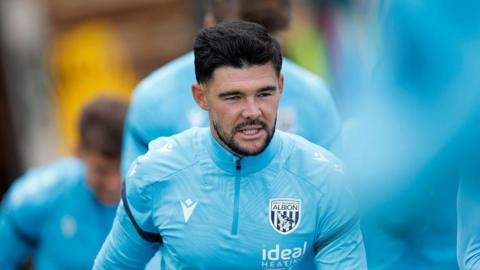 Alex Mowatt in his light blue training kit in action during pre-season warm-ups for West Bromwich Albion