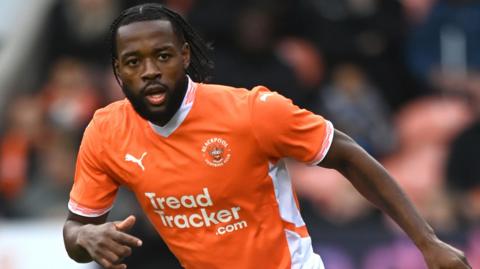 Josh Onomah in action for Blackpool