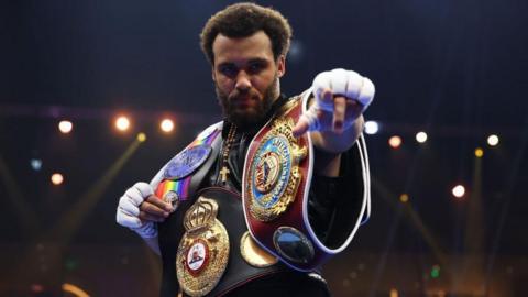 Moses Itauma celebrates with his belts 