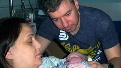 June and Fraser Morton with their baby Lucas in hospital shortly after he was born