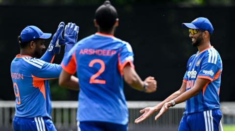  Prasidh Krishna (right) celebrates taking the wicket of Ben Calitz 