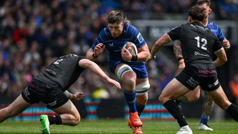 Dublin , Ireland - 7 June 2025; Joe McCarthy of Leinster is tackled by Gregor Hiddleston, left, and Tom Jordan of Glasgow Warriors during the United Rugby Championship semi-final match between Leinster and Glasgow Warriors at the Aviva Stadium in Dublin
