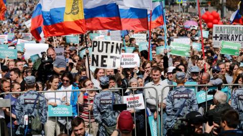Demonstrators take part in a rally to support opposition and independent candidates after authorities refused to register them for September elections to the Moscow City Duma, Moscow, July 20, 2019