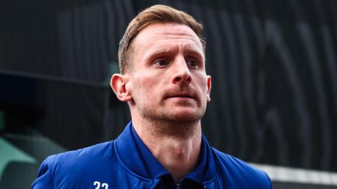 Tom Lees walks into Huddersfield Town's ground last season